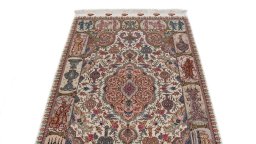 Central medallion detail of New Tabriz Silk rug from Iran / Persia