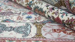 Close-up detail of New Tabriz Silk rug from Iran / Persia showing Wool weave