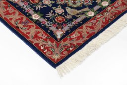 Backside of handmade New Tabriz Silk rug showing knot structure and weave density