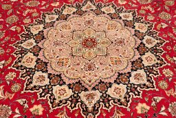 Corner detail of 2020s Tabriz Silk rug showing border pattern and Wool pile