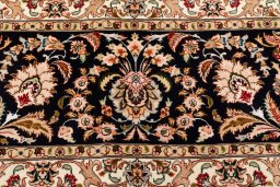 Backside of handmade 2020s Tabriz Silk rug showing knot structure and weave density