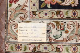 Corner detail of 2020s Tabriz Silk rug showing border pattern and Wool pile