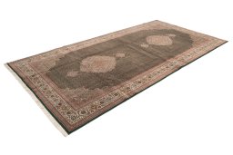 Corner detail of 2019s Tabriz Silk rug showing border pattern and Wool pile