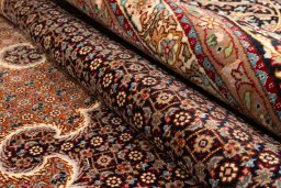 Close-up detail of 2020s Tabriz Silk rug from Iran / Persia showing Wool weave