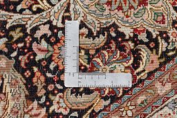 Backside of handmade 2020s Tabriz Silk rug showing knot structure and weave density