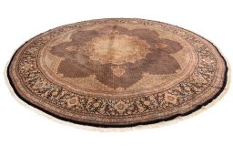 Corner detail of 2020s Tabriz Silk rug showing border pattern and Wool pile
