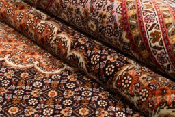 Surface texture of 2018s Tabriz Silk rug with natural Wool and intricate pattern