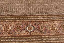 Corner detail of 2018s Tabriz Silk rug showing border pattern and Wool pile
