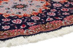 Backside of handmade New Tabriz Silk rug showing knot structure and weave density