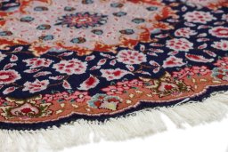 Backside of handmade New Tabriz Silk rug showing knot structure and weave density