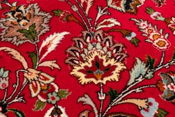 Backside of handmade New Tabriz Silk rug showing knot structure and weave density
