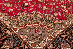 Backside of handmade New Tabriz Silk rug showing knot structure and weave density
