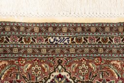 Surface texture of New Tabriz Silk rug with natural Wool and intricate pattern
