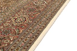 Close-up detail of New Tabriz Silk rug from Iran / Persia showing Wool weave