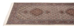 Corner detail of New Tabriz Silk rug showing border pattern and Wool pile