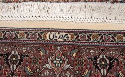 Corner detail of New Tabriz Silk rug showing border pattern and Wool pile