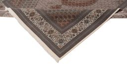 Backside of handmade New Tabriz Silk rug showing knot structure and weave density