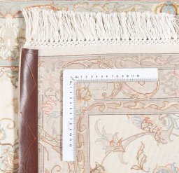 Corner detail of New Tabriz Silk rug showing border pattern and Wool pile