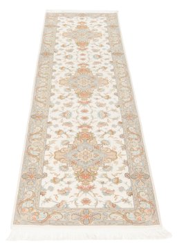 Backside of handmade New Tabriz Silk rug showing knot structure and weave density