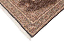 Corner detail of New Tabriz Silk rug showing border pattern and Wool pile