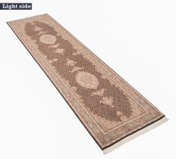 Backside of handmade New Tabriz Silk rug showing knot structure and weave density