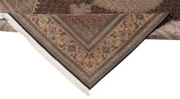 Backside of handmade New Tabriz Silk rug showing knot structure and weave density