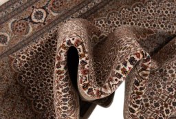 Surface texture of New Tabriz Silk rug with natural Wool and intricate pattern