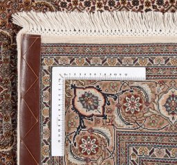 Backside of handmade New Tabriz Silk rug showing knot structure and weave density