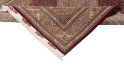 Backside of handmade New Tabriz Silk rug showing knot structure and weave density