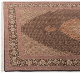 Close-up detail of New Tabriz Silk rug from Iran / Persia showing Wool weave