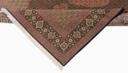 Backside of handmade New Tabriz Silk rug showing knot structure and weave density