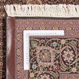 Backside of handmade New Tabriz Silk rug showing knot structure and weave density