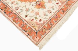 Corner detail of New Tabriz Silk rug showing border pattern and Wool pile