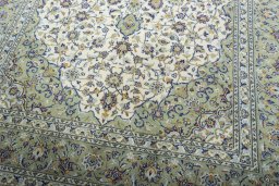 Close-up detail of 2000s Kashan rug from Iran / Persia showing Wool weave
