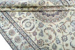 Close-up detail of 2000s Nain rug from Iran / Persia showing Wool weave