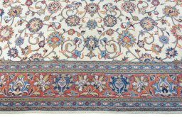 Corner detail of 2000s Sarough rug showing border pattern and Wool pile