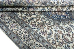 Close-up detail of 2000s Nain rug from Iran / Persia showing Wool weave