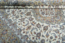 Close-up detail of 2000s Kashan rug from Iran / Persia showing Wool weave