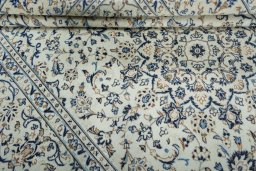 Close-up detail of 2000s Kashan rug from Iran / Persia showing Wool weave