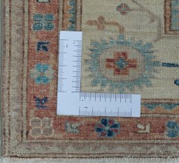 Corner detail of New Kazak rug showing border pattern and Wool pile