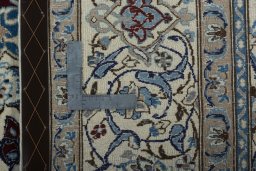 Backside of handmade 2000s Nain rug showing knot structure and weave density