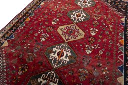 Backside of handmade 2000s Shiraz rug showing knot structure and weave density