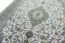 Backside of handmade 2000s Kashan rug showing knot structure and weave density