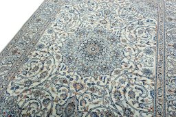 Backside of handmade 2000s Kashmar rug showing knot structure and weave density