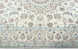 Corner detail of 2000s Nain rug showing border pattern and Wool pile