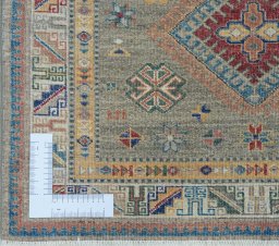 Corner detail of New Kazak rug showing border pattern and Wool pile