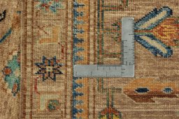 Backside of handmade New Kazak rug showing knot structure and weave density