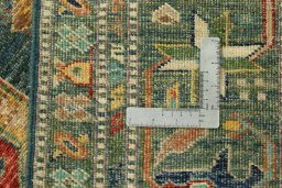 Backside of handmade New Kazak rug showing knot structure and weave density