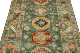Backside of handmade New Kazak rug showing knot structure and weave density