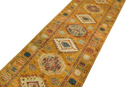 Backside of handmade New Kazak rug showing knot structure and weave density